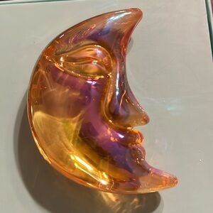 Carved stone moon with face